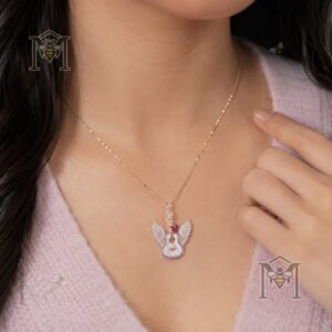 Dolly Parton angelic guitar pendant displayed with rose-gold chain