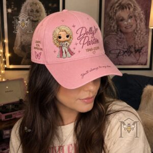 Detailed view of the side of the pink Dolly Parton hat cap showing "LEGEND. ICON. INSPIRATION."