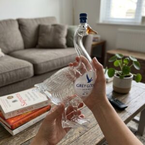 Grey Goose Vodka 3D Sculpted Whiskey Bottle Collector Edition - lower body and feet held over marble counter
