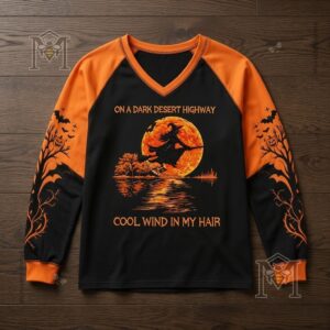 Halloween Witch Flying Moon Hotel Long Sleeve T-shirt - close-up of the short-sleeve version on a dark wood