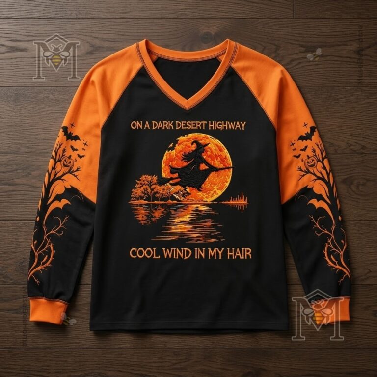 Halloween Witch Flying Moon Hotel Long Sleeve T-shirt - close-up of the short-sleeve version on a dark wood