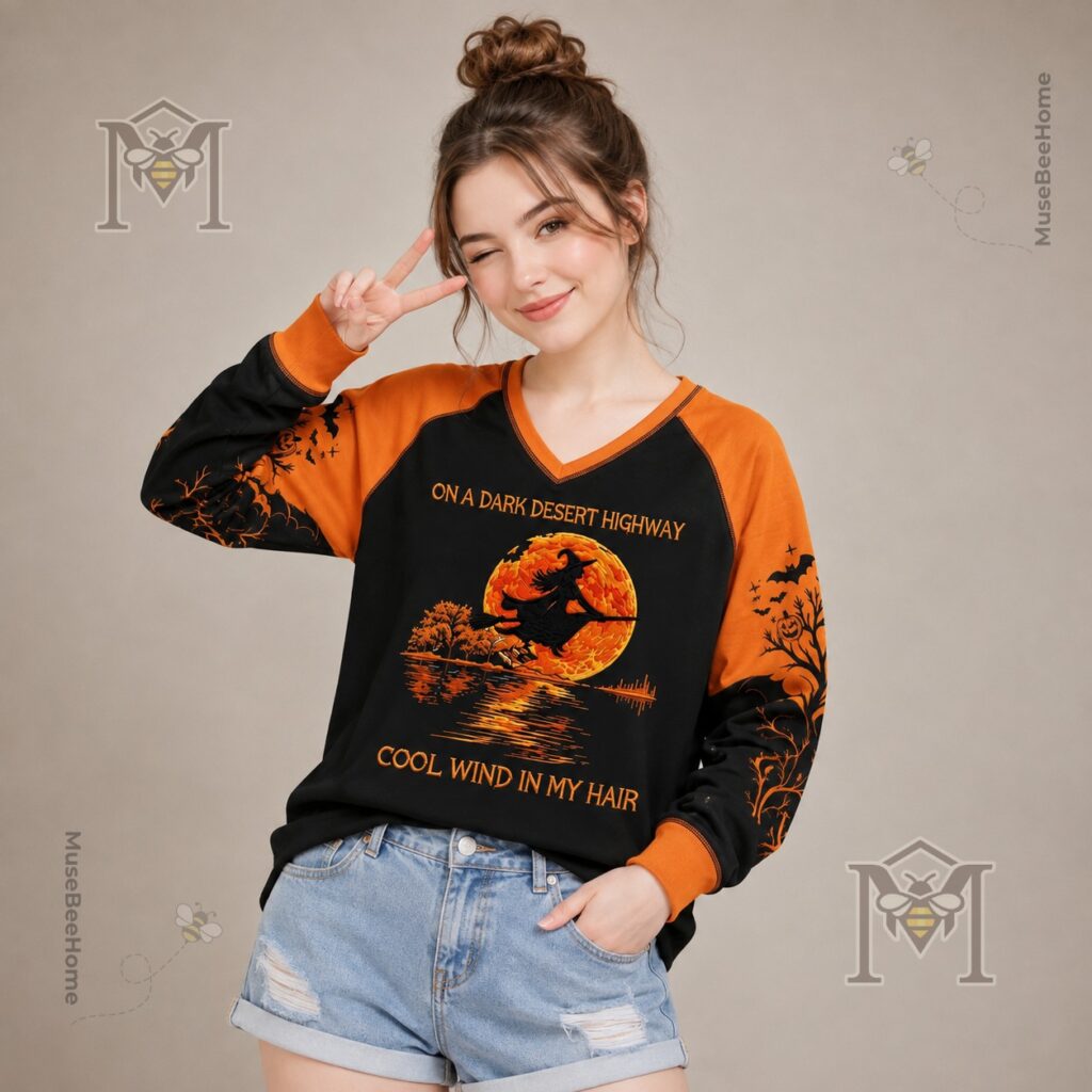Halloween Witch Flying Moon Hotel Long Sleeve T-shirt - side view of the long-sleeve top's patterned sleeve