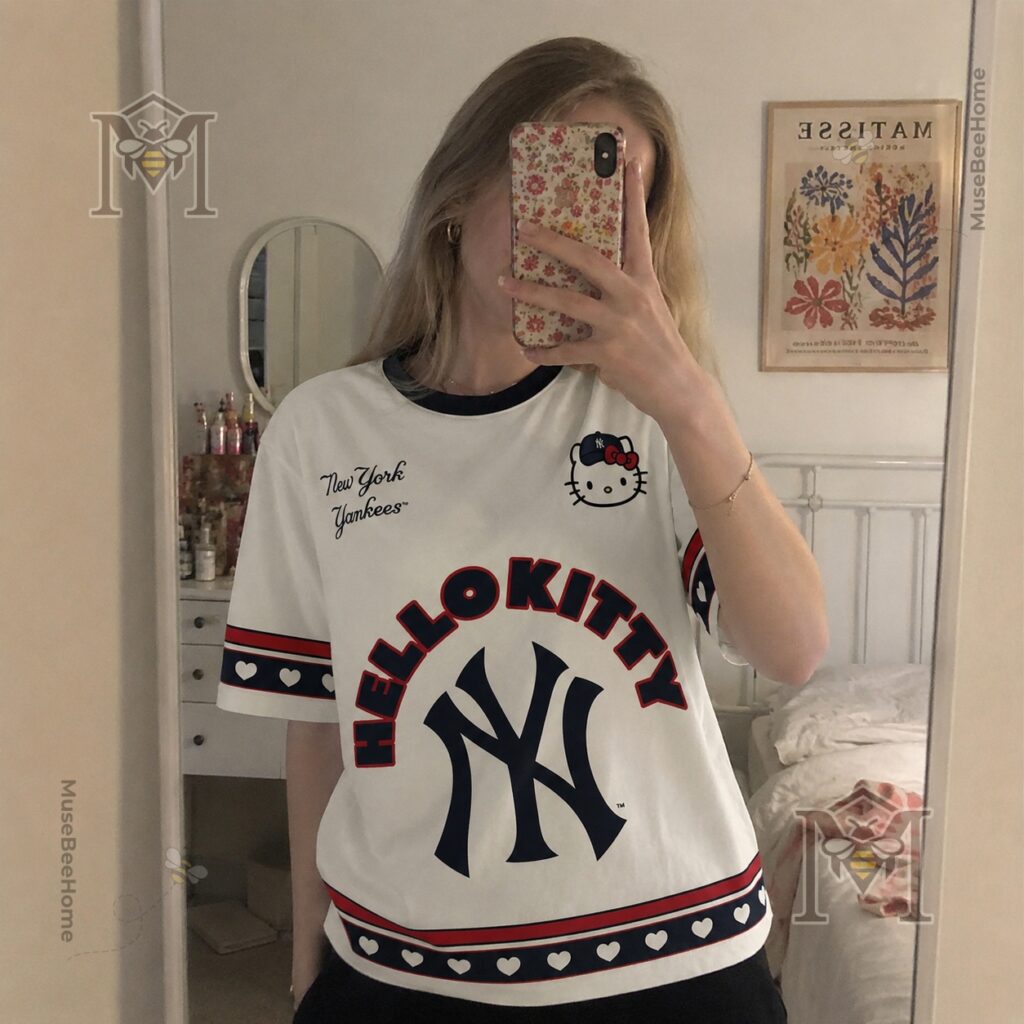 Lower left detail of the New York Yankees Hello Kitty T-Shirt hem and sleeve with heart pattern