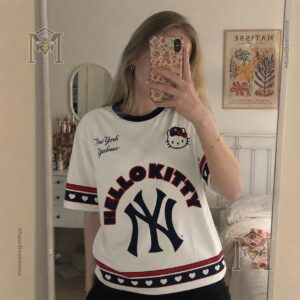 Lower left detail of the New York Yankees Hello Kitty T-Shirt hem and sleeve with heart pattern