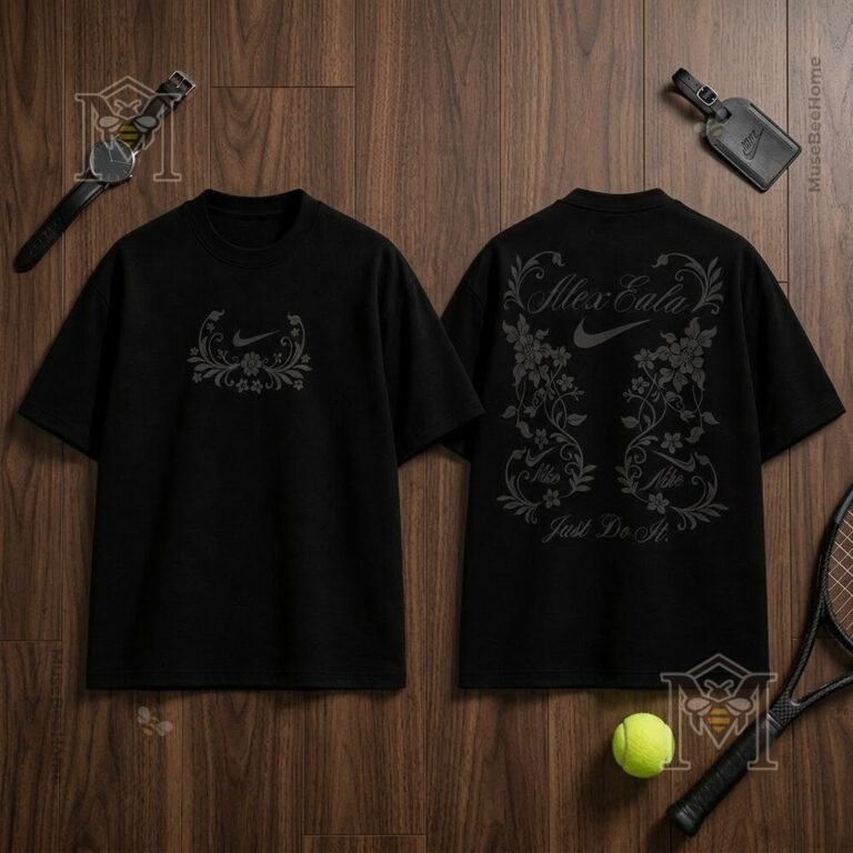 Nike Alexandra Eala Floral 2026 Black T-Shirt - front and back views on wooden surface with tennis racket and