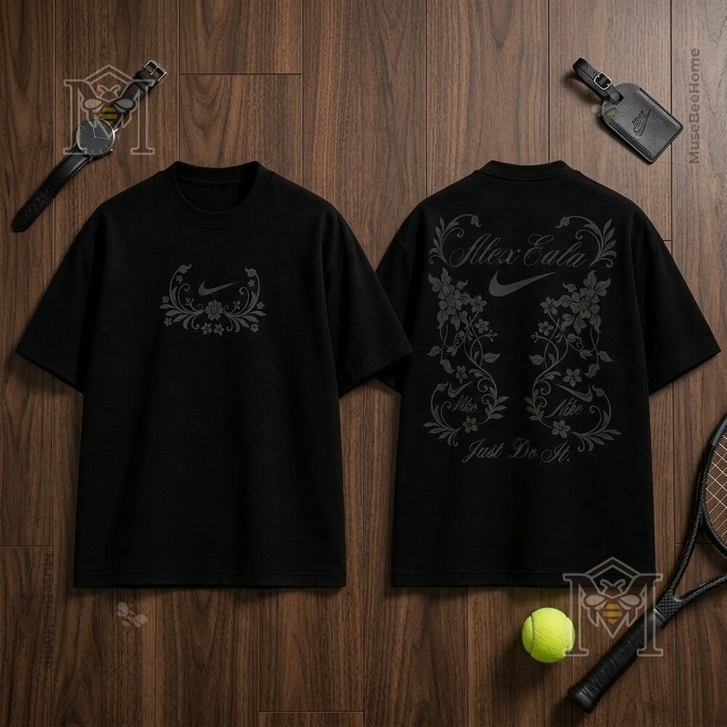 Nike Alexandra Eala Floral 2026 Black T-Shirt – Front and back views on Nike Alexandra Eala Floral 2026 Black T-Shirt - front and back views on wooden surface with tennis racket and
